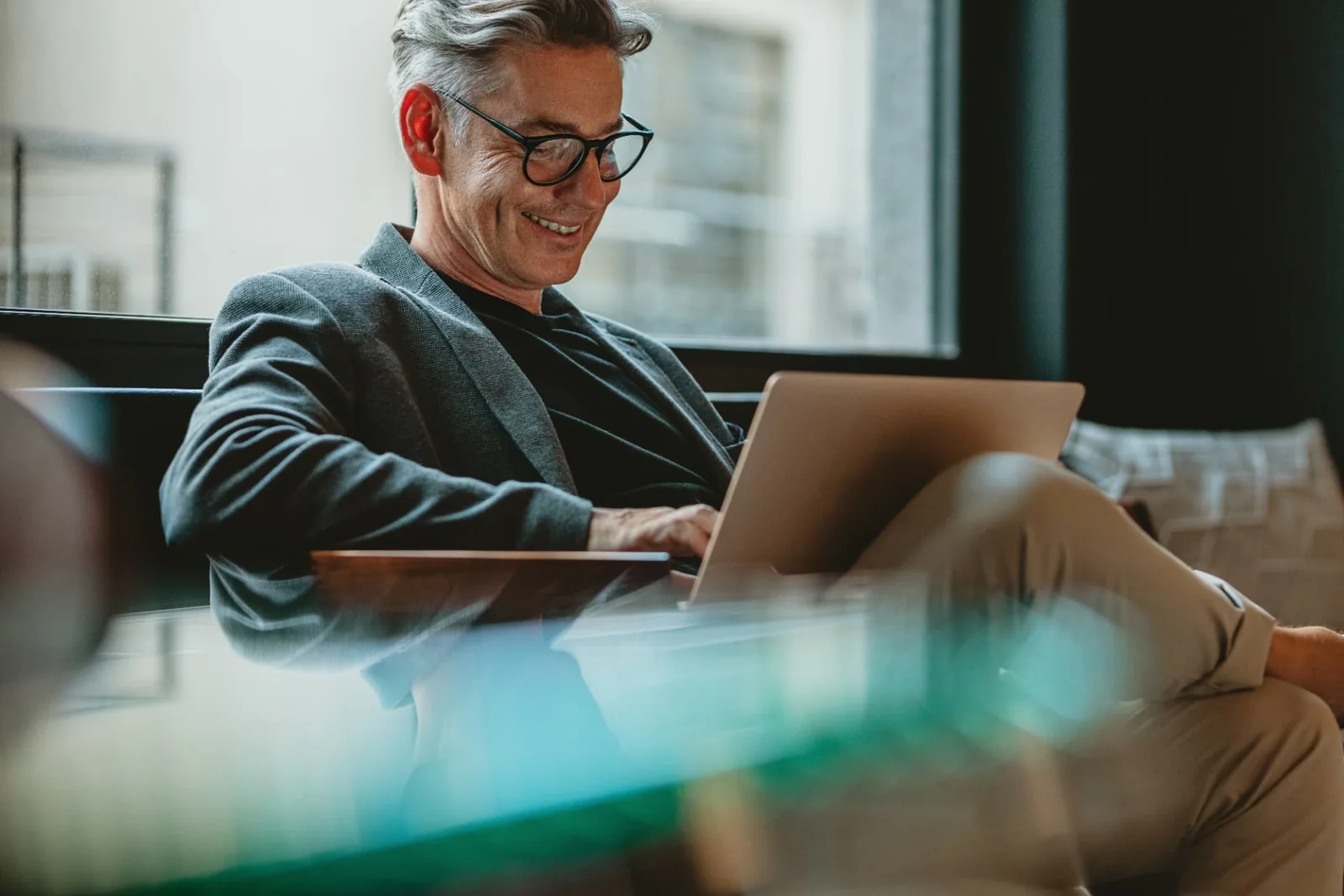 Adviser working at a laptop